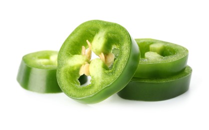 Photo of Slices of green jalapeno pepper isolated on white