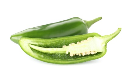 Photo of Whole and cut green jalapeno peppers isolated on white