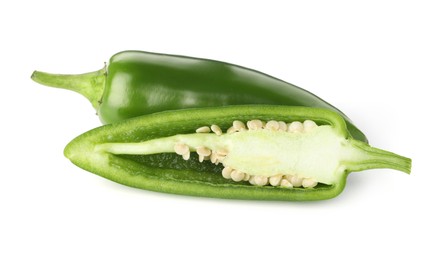 Photo of Whole and cut green jalapeno peppers isolated on white
