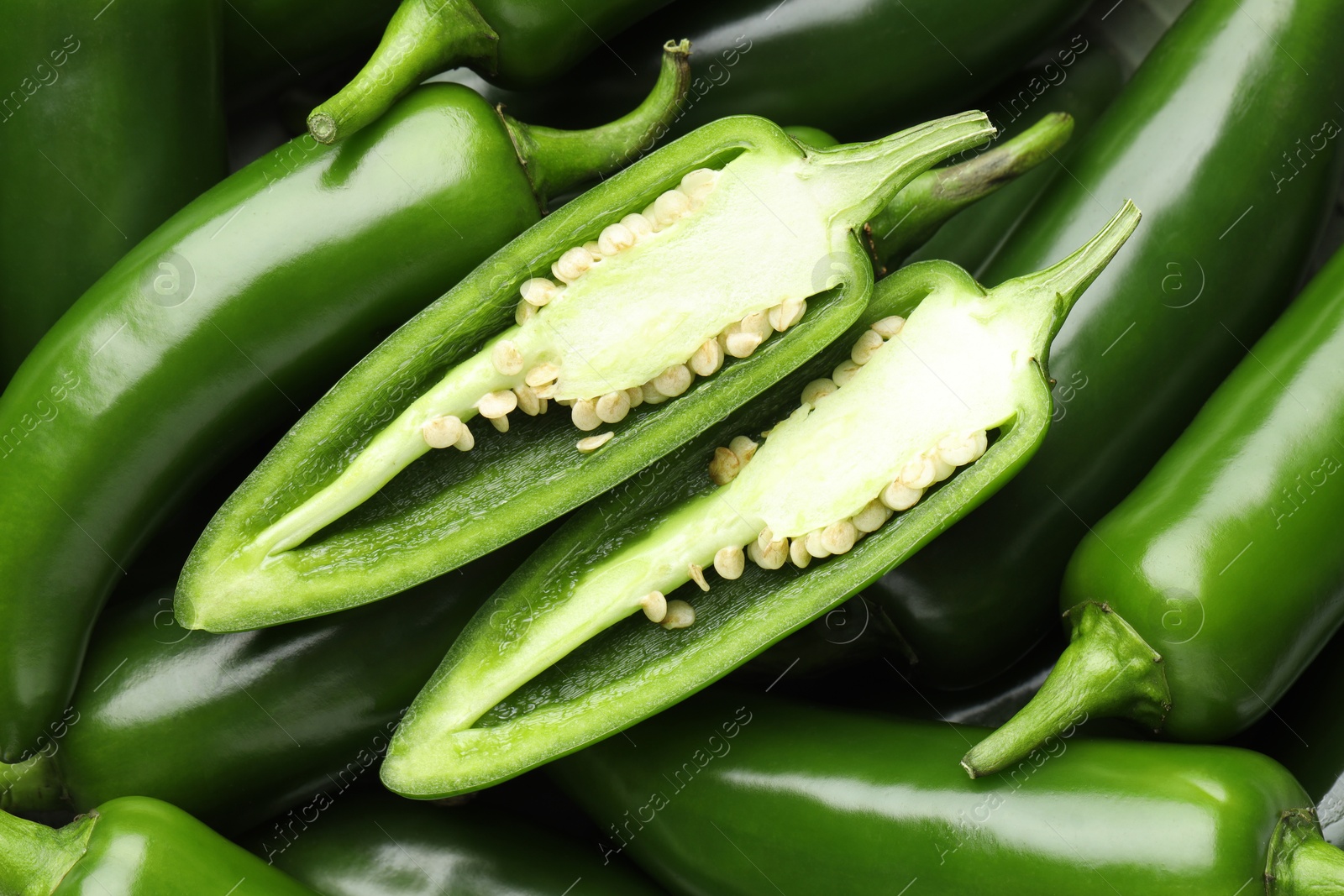 Photo of Fresh green jalapeno peppers as background, top view