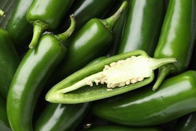 Photo of Fresh green jalapeno peppers as background, top view