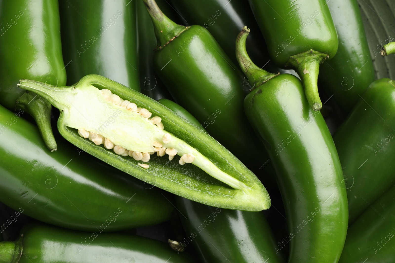 Photo of Fresh green jalapeno peppers as background, top view