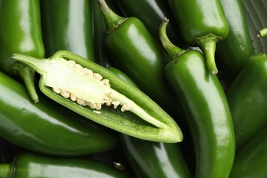Photo of Fresh green jalapeno peppers as background, top view