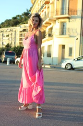 Photo of Portrait of beautiful woman on city street