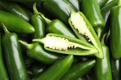 Photo of Fresh green jalapeno peppers as background, top view