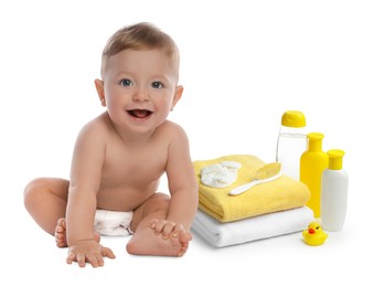 Image of Cute little baby, bathing accessories and toiletries isolated on white
