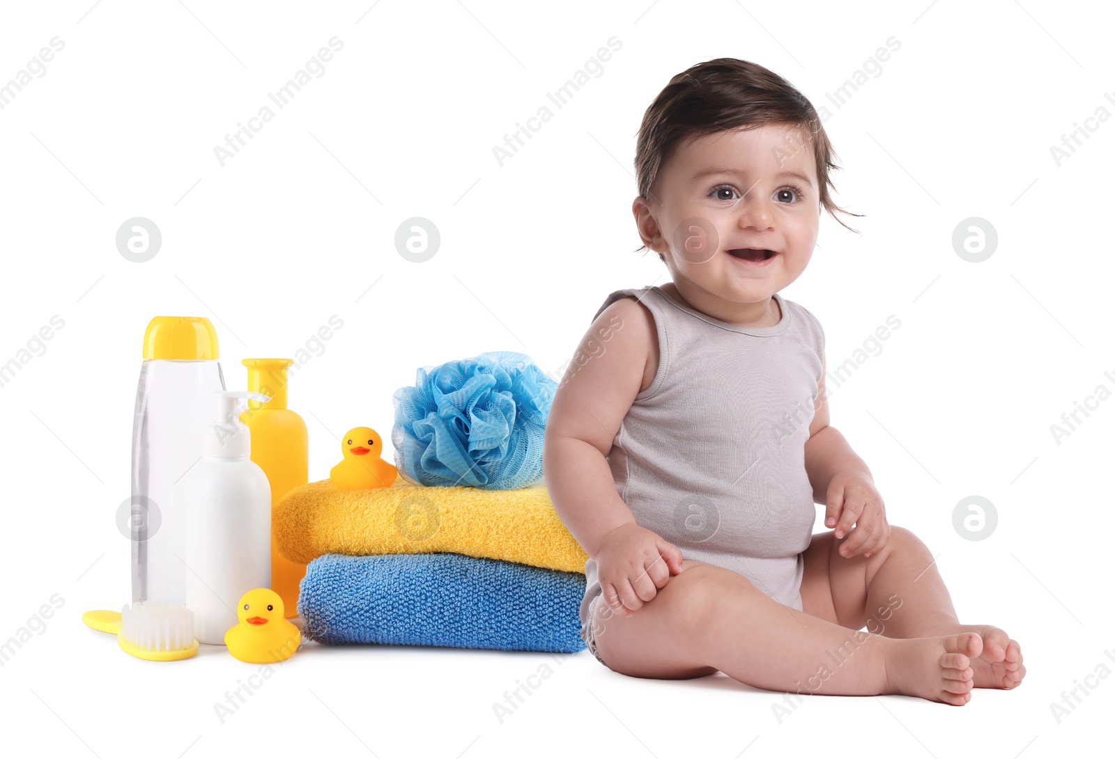 Image of Cute little baby, bathing accessories and toiletries isolated on white
