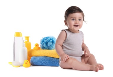 Image of Cute little baby, bathing accessories and toiletries isolated on white