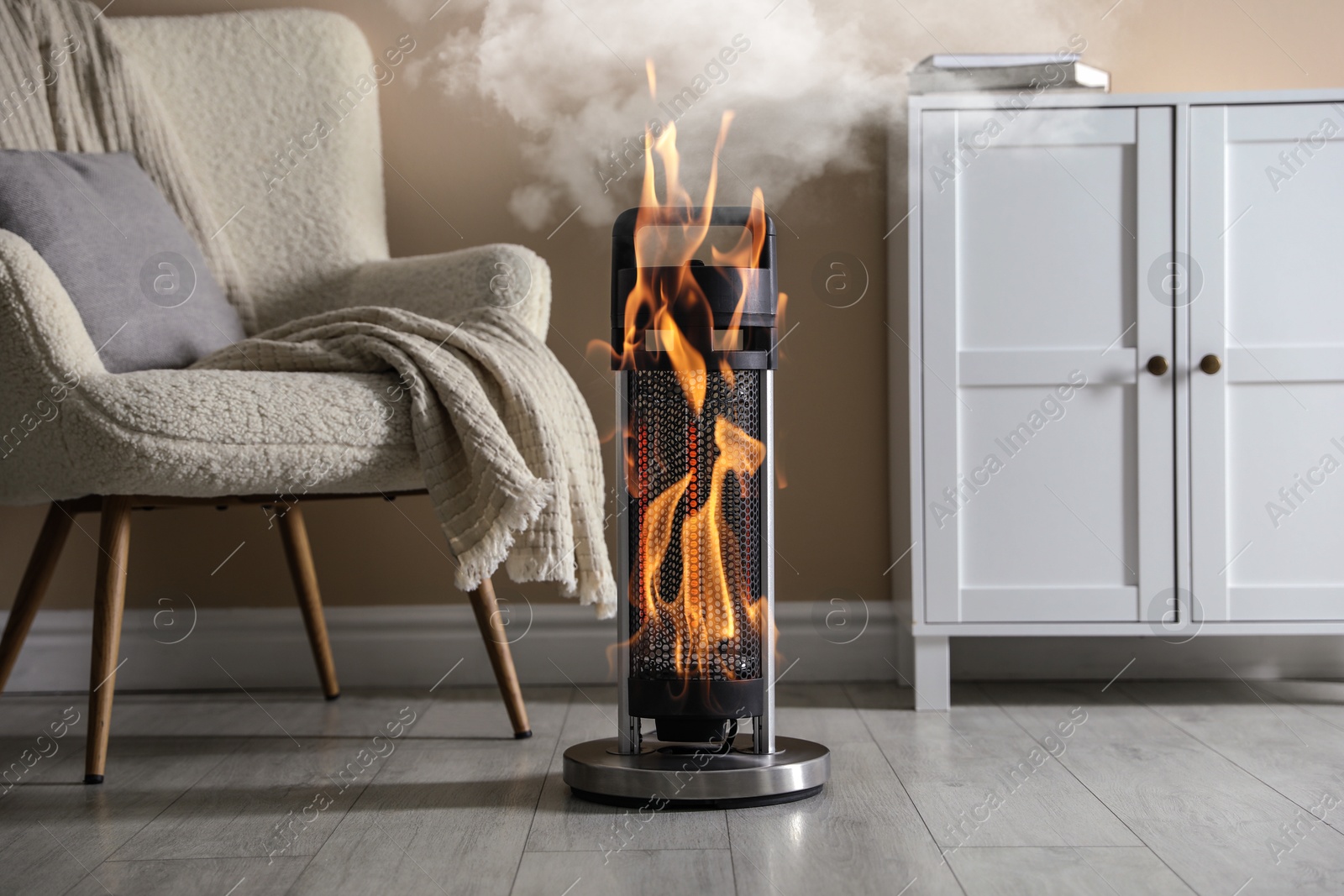 Image of Burning heater in room, flames all over device. Do not leave unattended