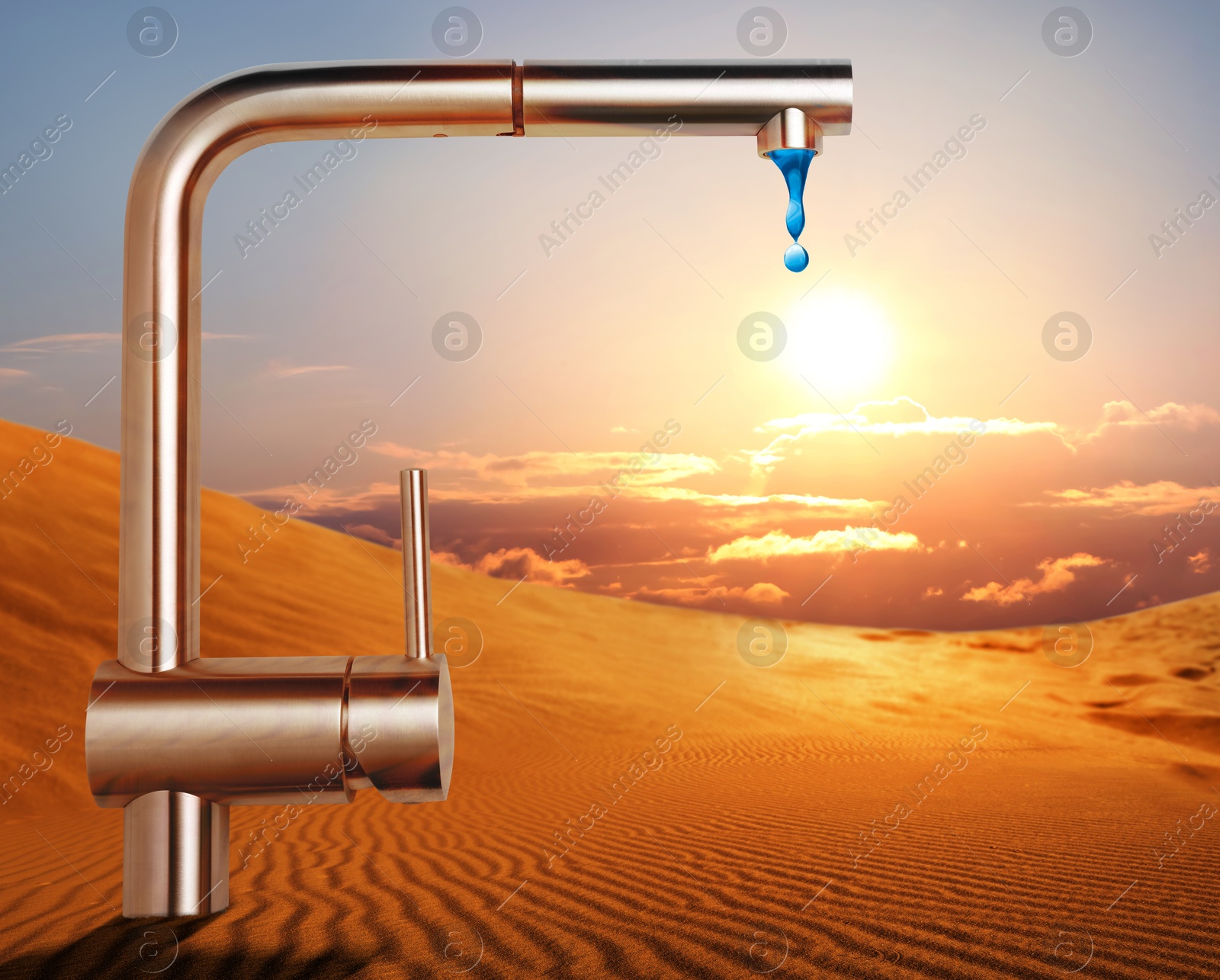 Image of Save water concept. Tap with dripping water in desert under scorching sun