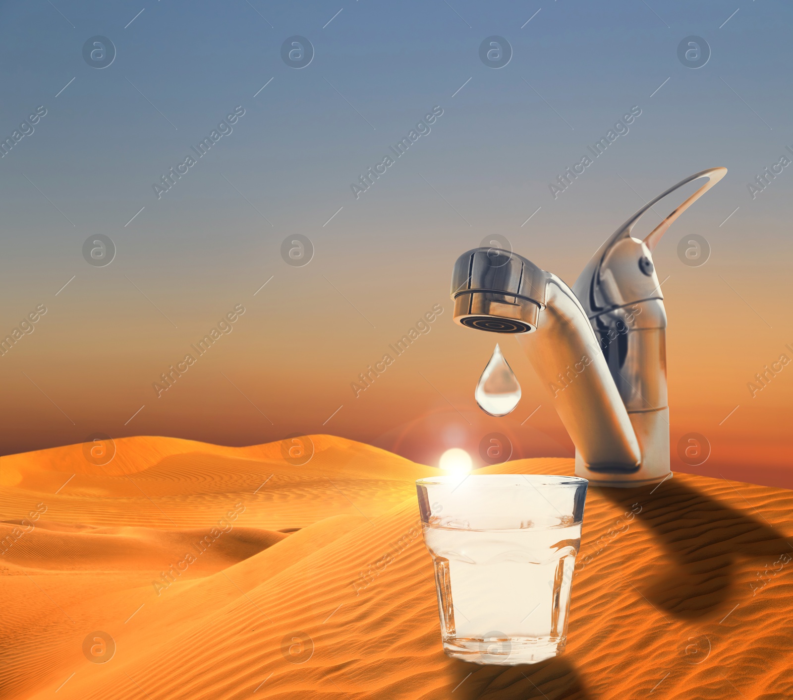 Image of Save water concept. Glass under tap with dripping water in desert