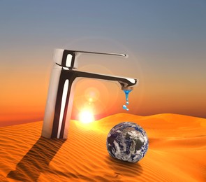 Image of Save water concept. Earth under tap with dripping water in desert