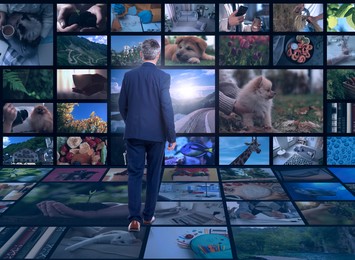 Image of Media library. Man in virtual space with collection of video files