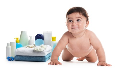 Image of Cute little baby, bathing accessories and toiletries isolated on white