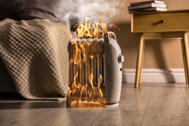 Image of Burning heater in room, flames all over device. Do not leave unattended