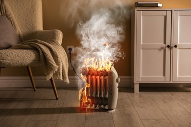 Image of Burning heater in room, flames all over device. Do not leave unattended