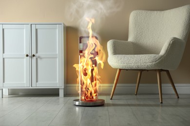 Image of Burning heater in room, flames all over device. Do not leave unattended