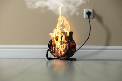 Image of Burning heater in room, flames all over device. Do not leave unattended