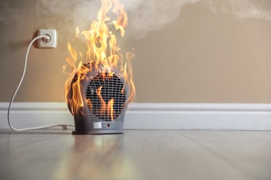 Image of Burning heater in room, flames all over device. Do not leave unattended