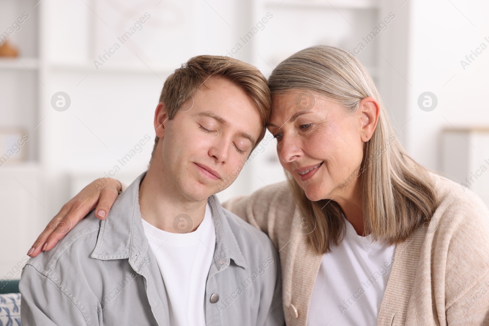 Photo of Happy mother and her son at home