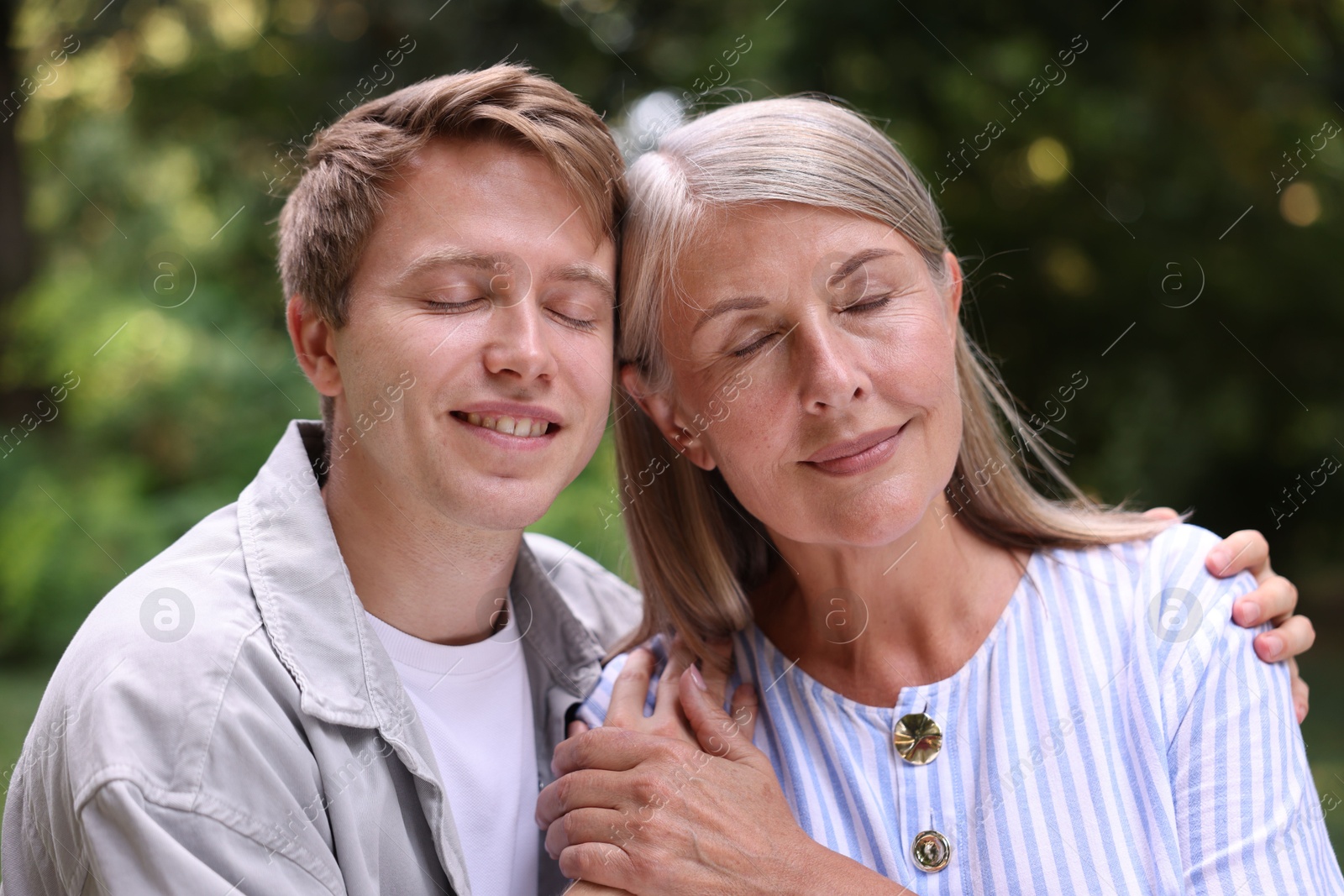 Photo of Mother and her happy son outdoors. Family bonding