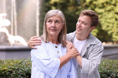 Photo of Mother and her son outdoors. Family bonding