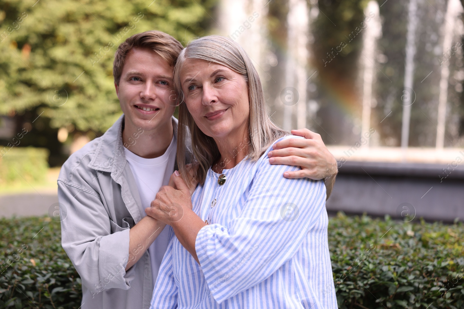 Photo of Mother and her son outdoors, space for text. Family bonding
