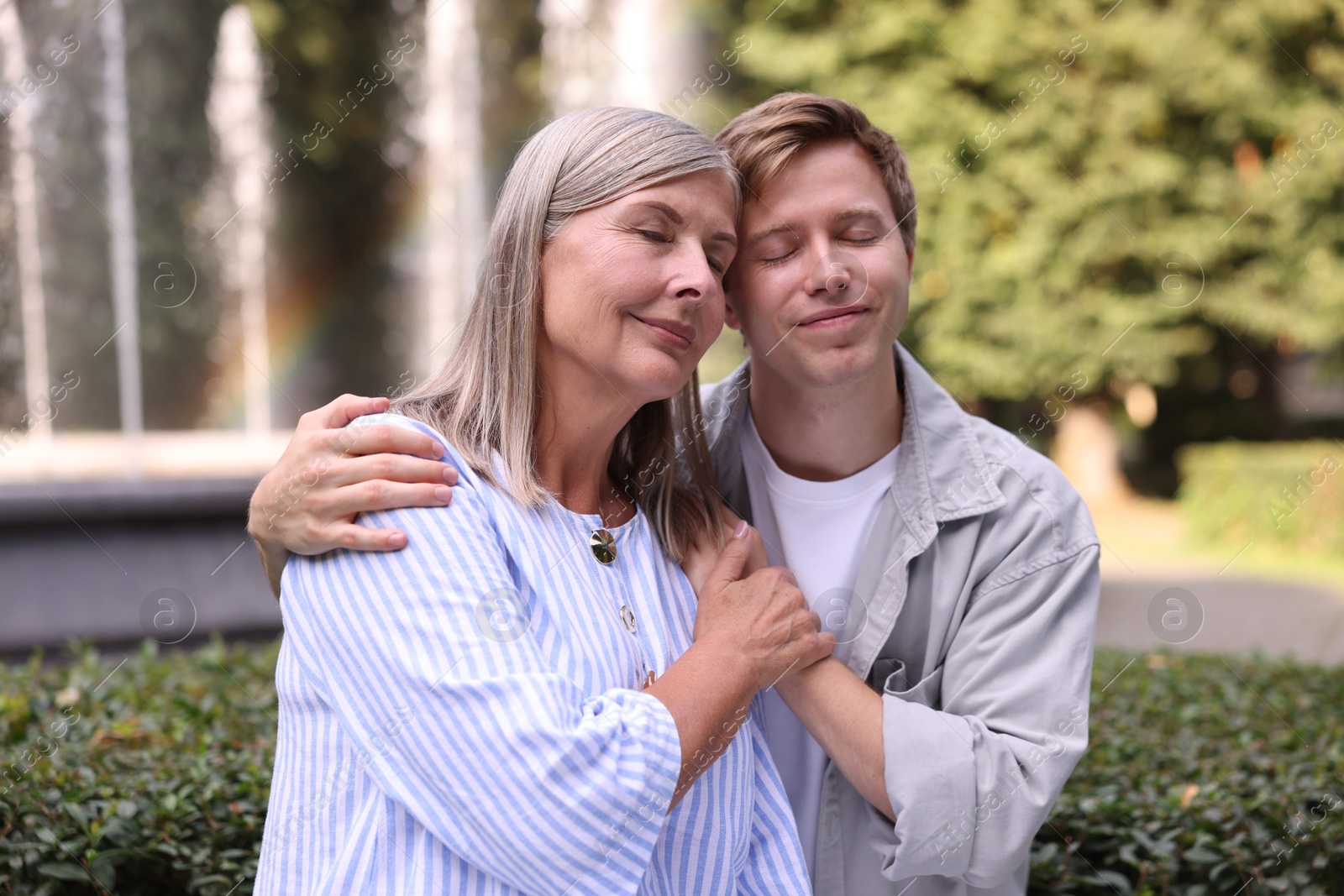 Photo of Mother and her son outdoors. Family bonding