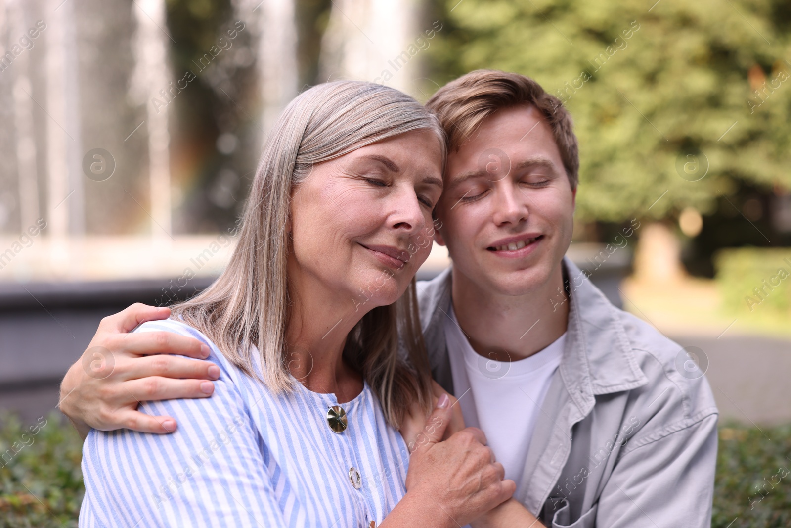 Photo of Mother and her son outdoors. Family bonding