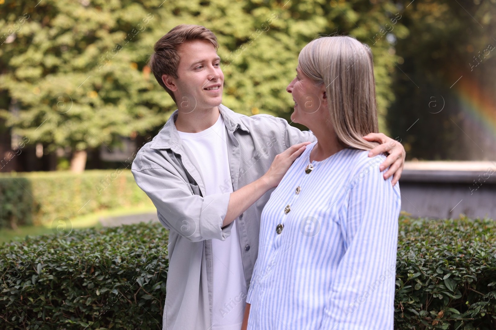 Photo of Mother and her son outdoors. Family bonding