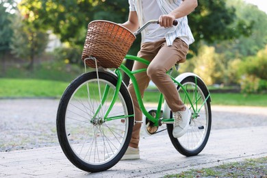 Photo of Man riding bicycle on city street, closeup