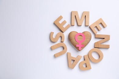 Photo of Word Menopause, female gender symbol and wooden heart on white background, top view. Space for text