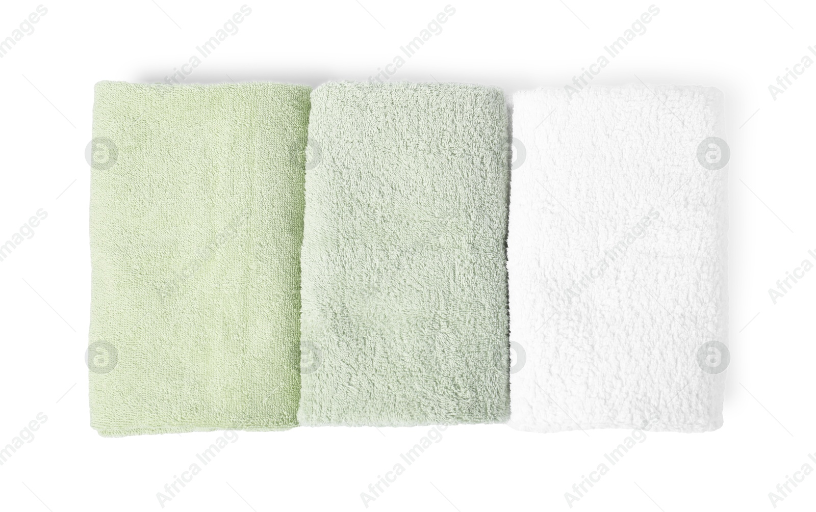 Photo of Fresh terry towels isolated on white, top view