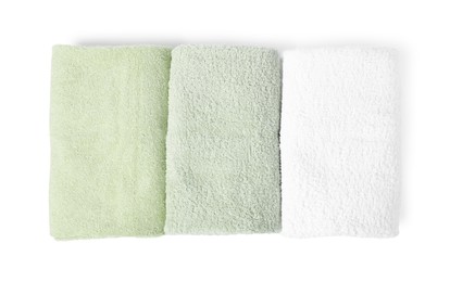 Photo of Fresh terry towels isolated on white, top view