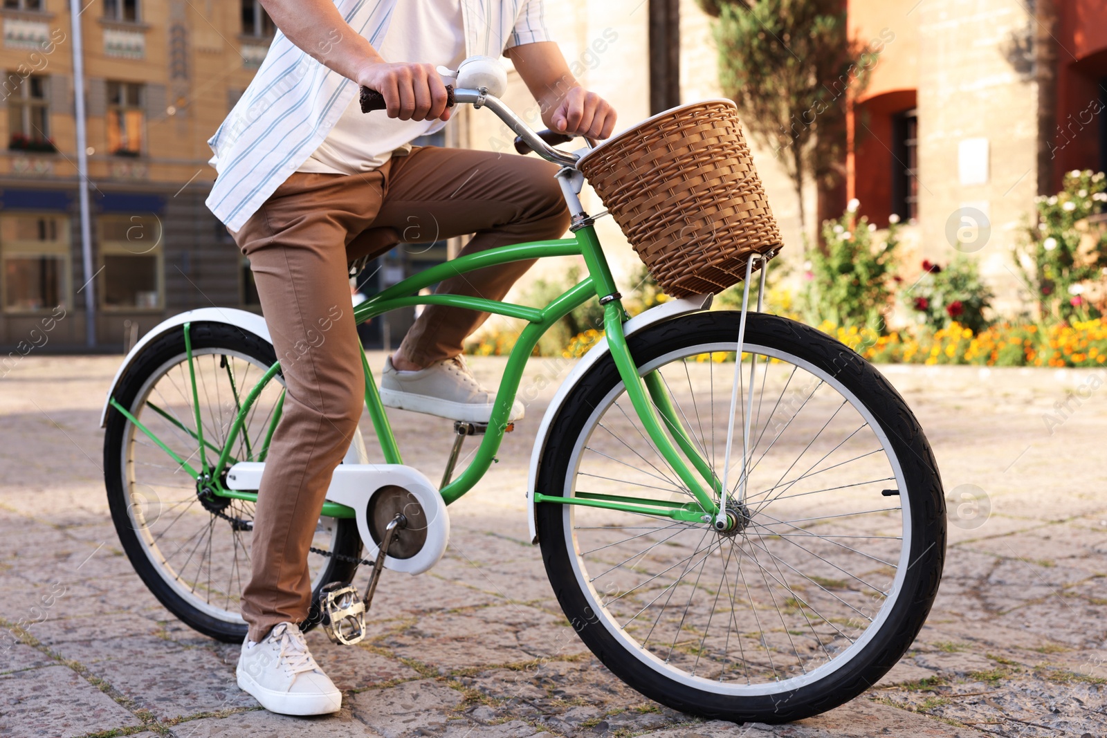 Photo of Man riding bicycle on city street, closeup
