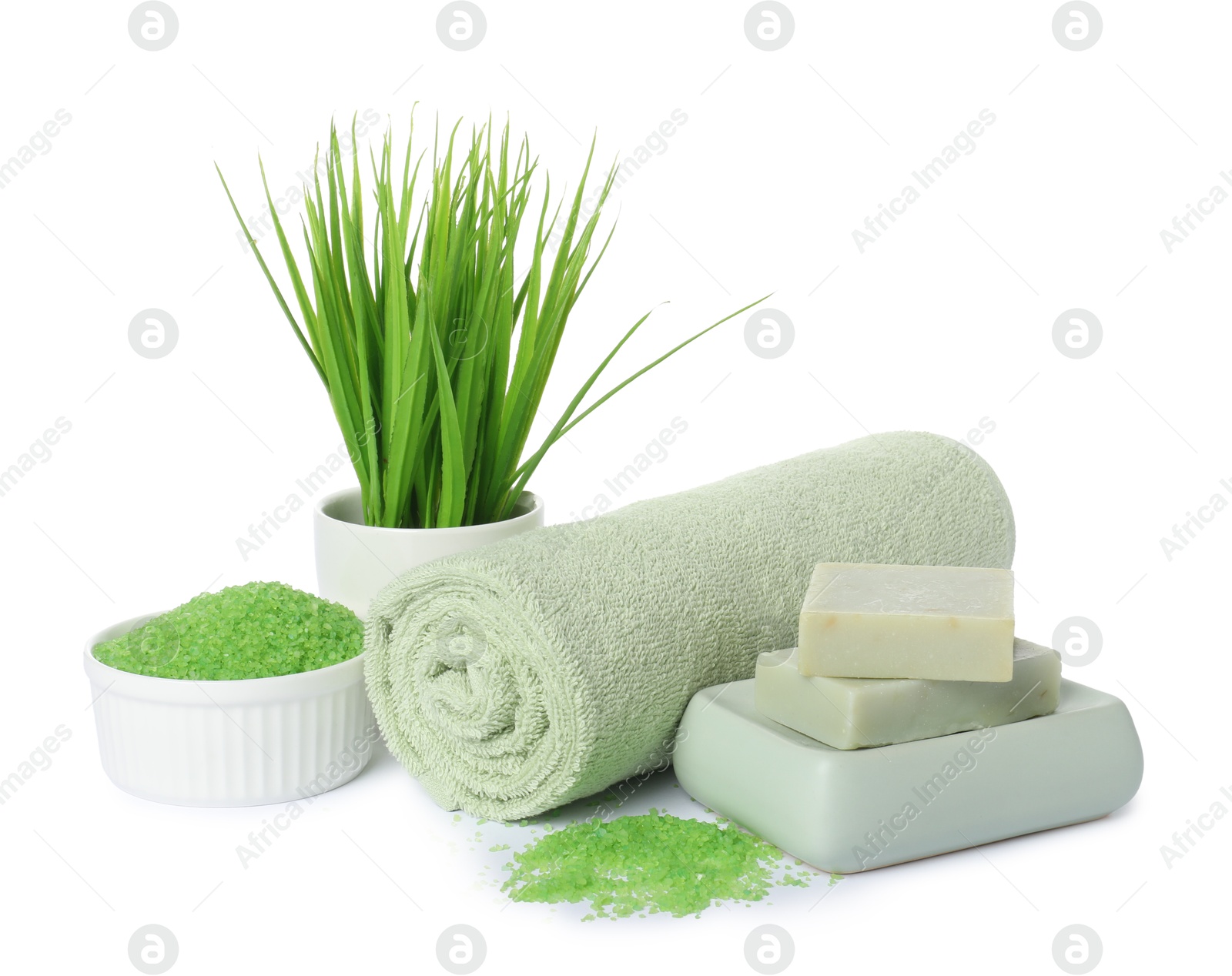 Photo of Rolled fresh terry towel, cosmetic products and floral decor isolated on white
