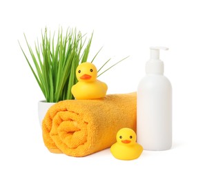 Photo of Rolled fresh terry towel, cosmetic product, rubber ducks and floral decor isolated on white