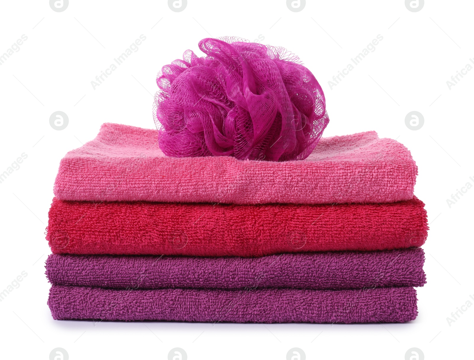 Photo of Stack of fresh terry towels and sponge isolated on white