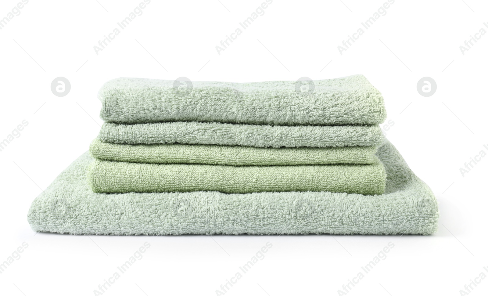 Photo of Stack of fresh terry towels isolated on white