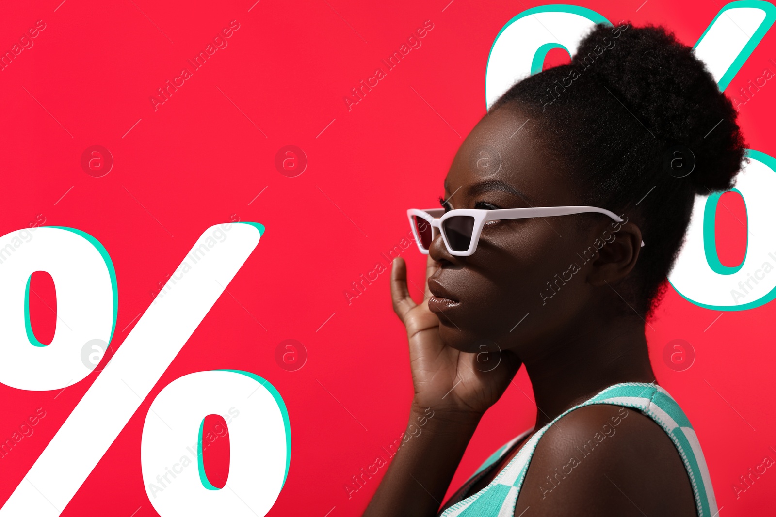 Image of Woman in stylish sunglasses and percent signs on red background