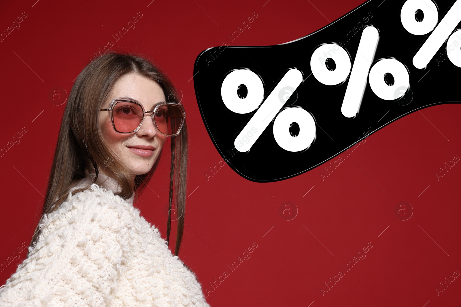 Image of Fashionable woman and percent signs against dark red background