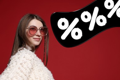 Image of Fashionable woman and percent signs against dark red background