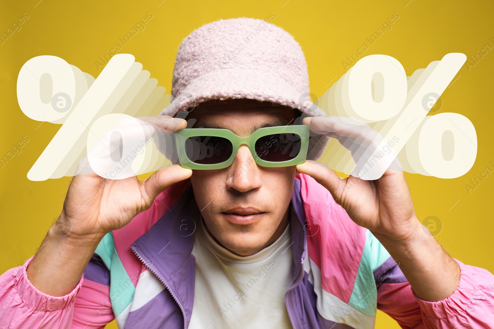 Image of Fashionable man and percent signs against yellow background