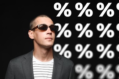 Image of Fashionable man and percent signs against black background