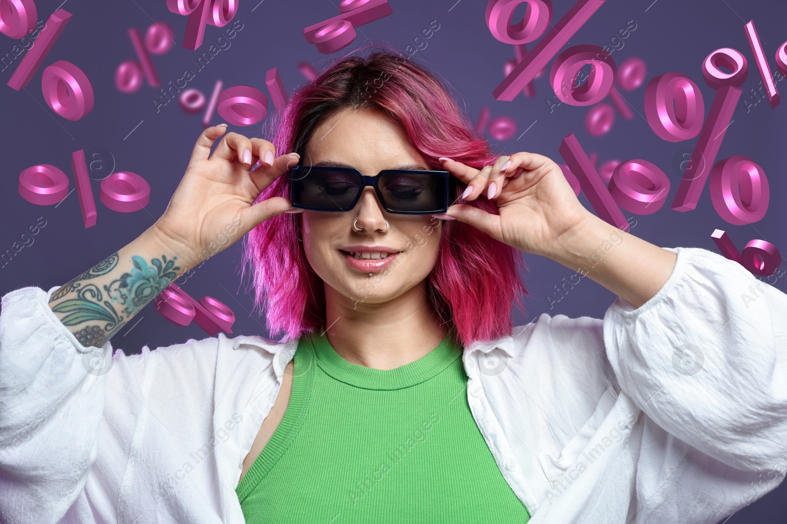 Image of Fashionable woman with bright hair against grey background with falling percent signs