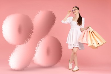Image of Happy woman and fluffy percent sign against pink background
