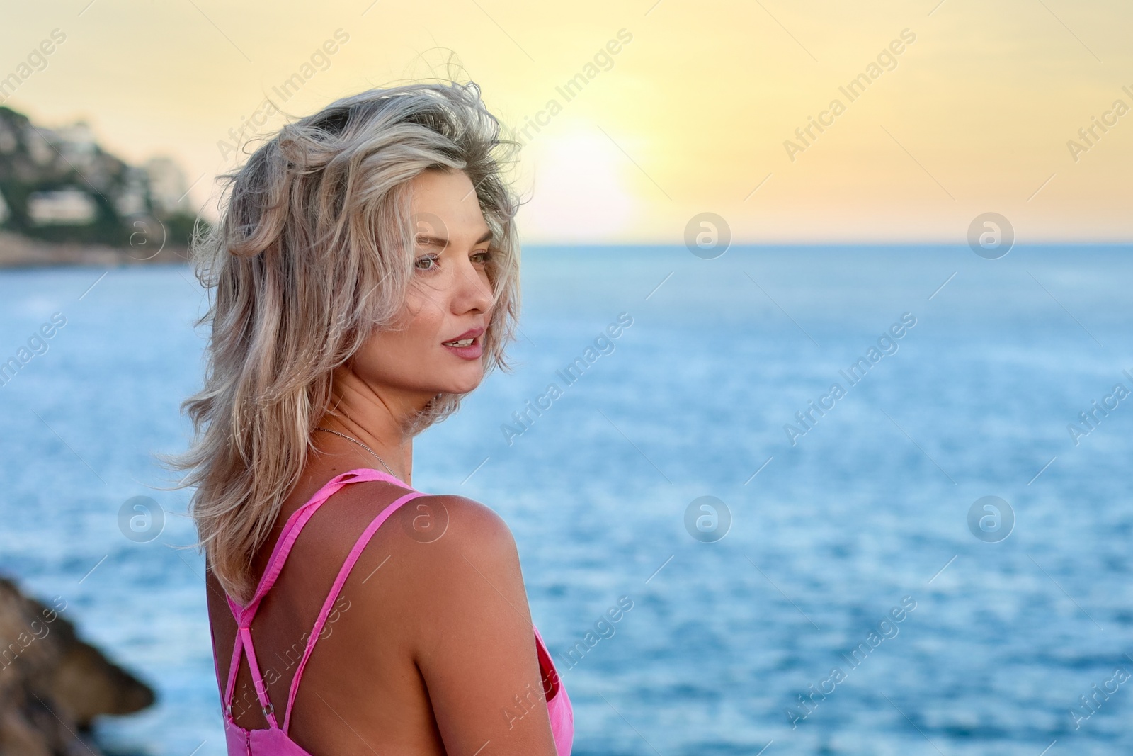 Photo of Beautiful woman near sea on summer day, space for text