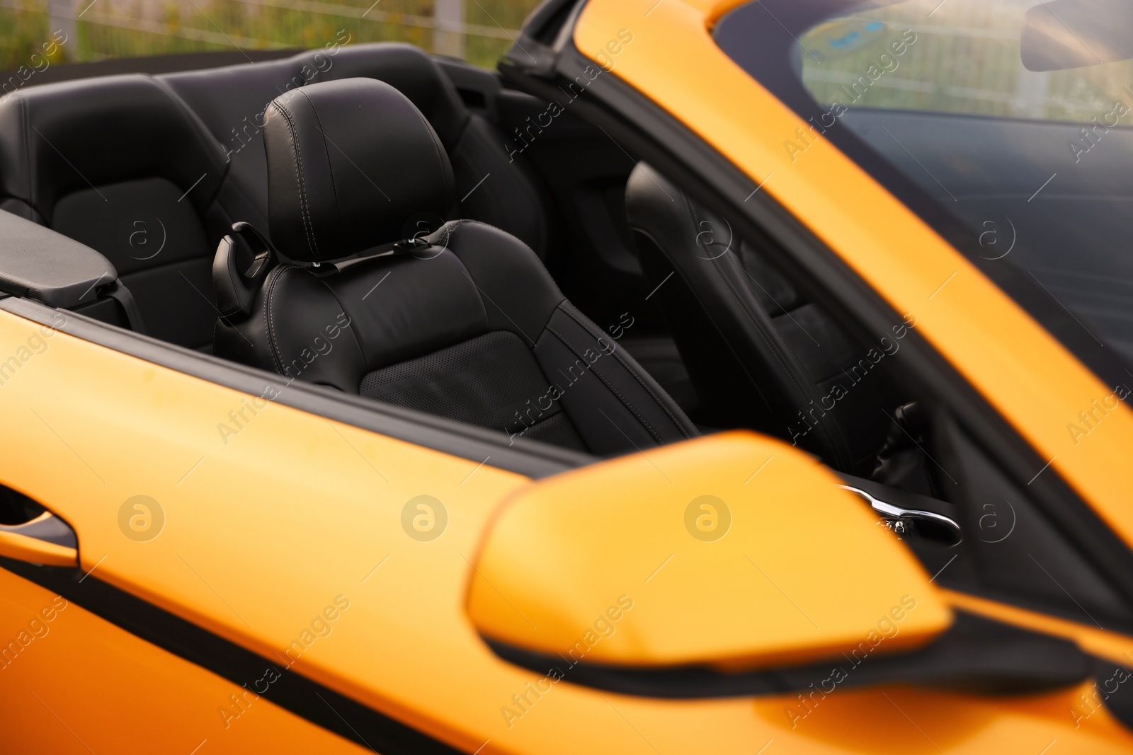 Photo of Closeup view of modern bright cabriolet. Vehicle