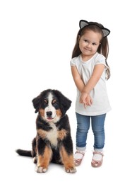 Image of Cute child and fluffy dog on white background. First pet