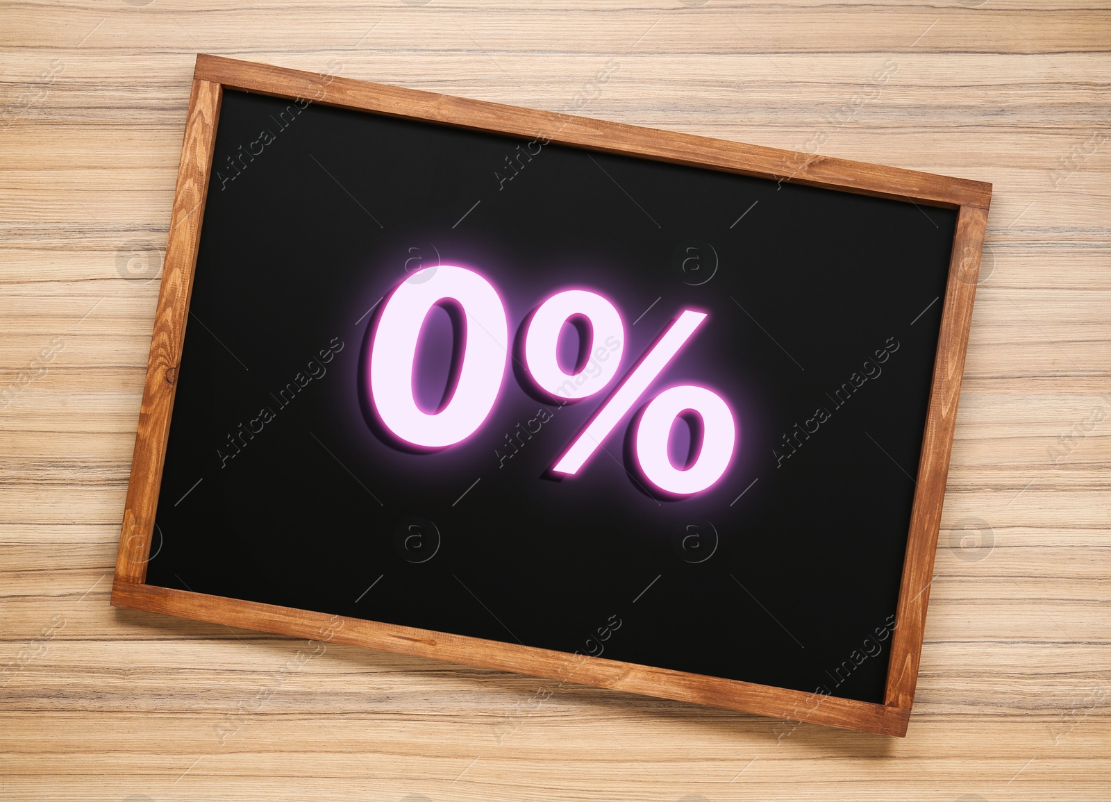 Image of Zero percent commission. Chalkboard with 0% on wooden background, top view